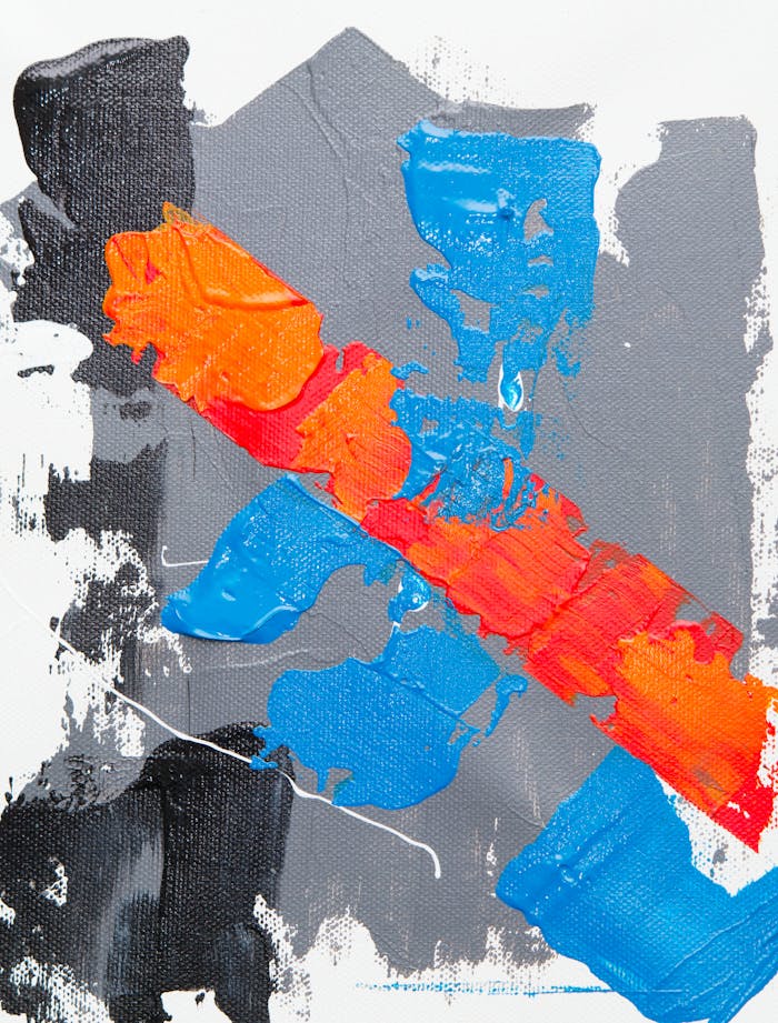 Colorful abstract art with striking red, blue, and orange brushstrokes on canvas.